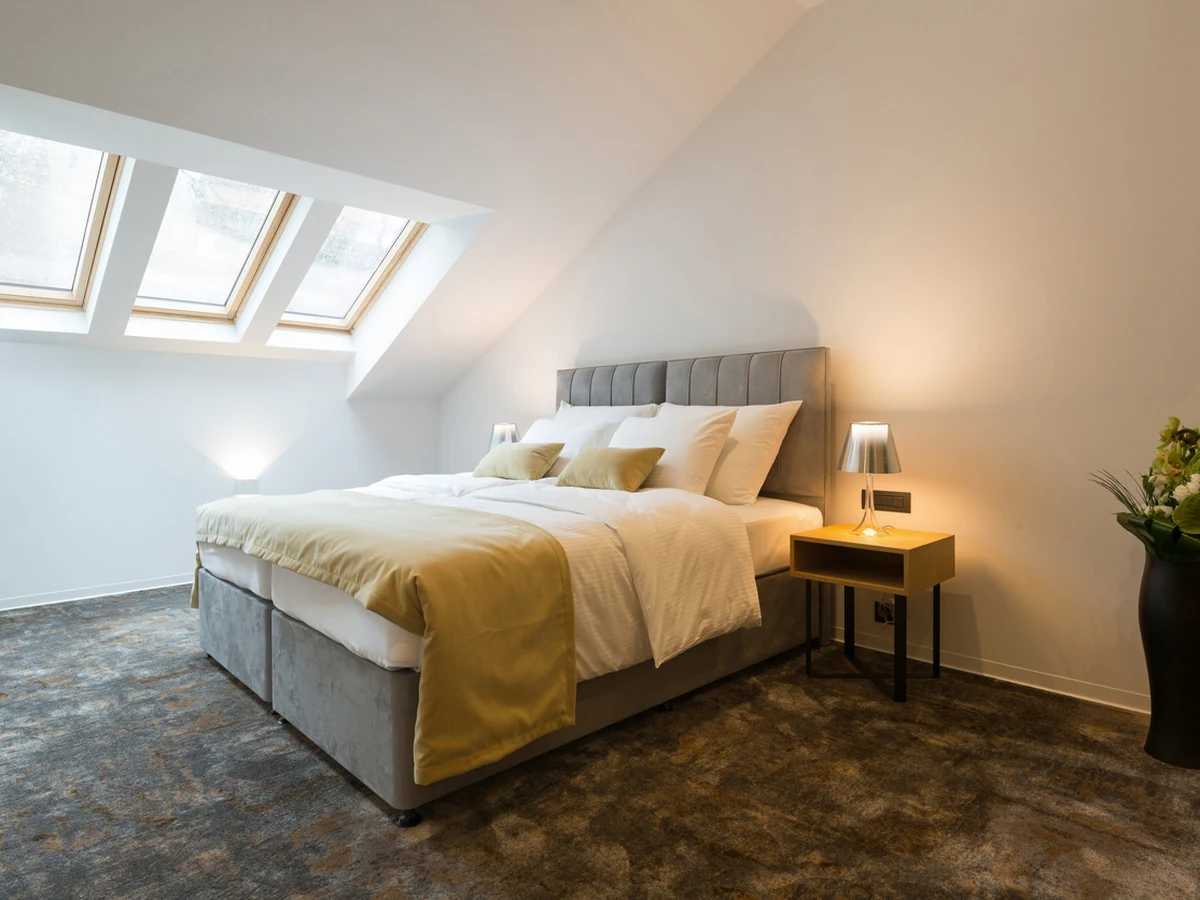 bedroom-painting-loft-bedroom-skylights-bath-decorators Loft bedroom with skylights painted by Bath Decorators, bright and minimal finish