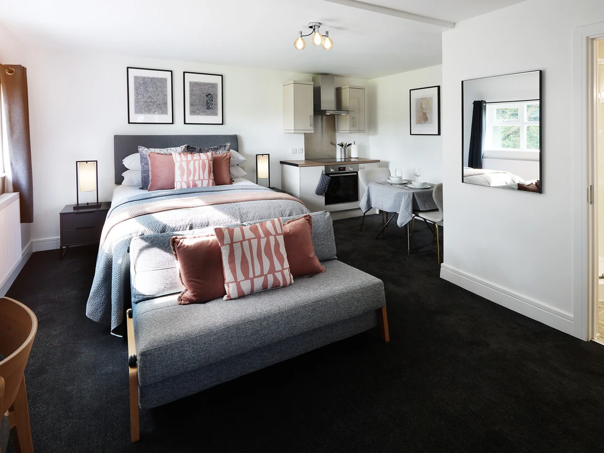 Feature wall wallpapering in a double bedroom in Bath