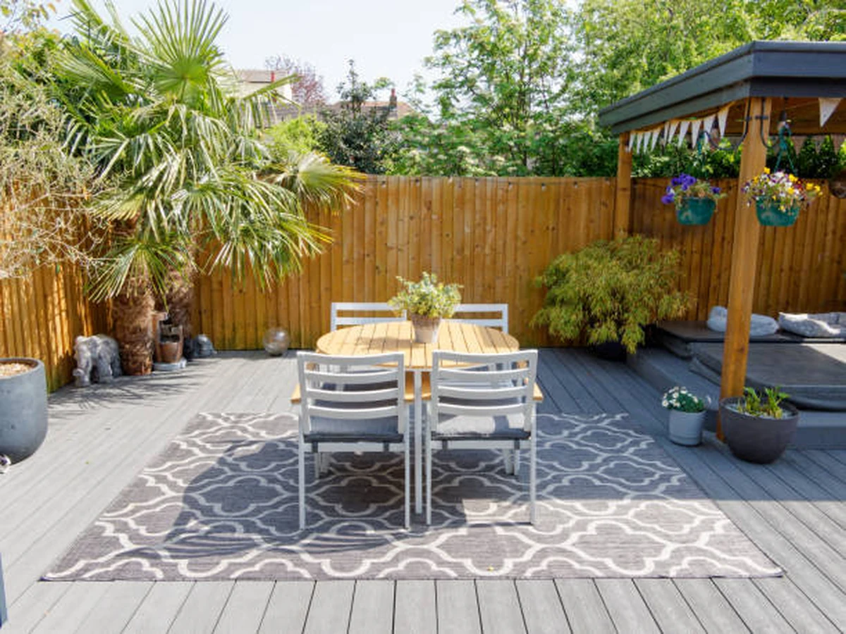 Deck painting in Bath by Bath Decorators — garden deck dining area with freshly painted timber boards