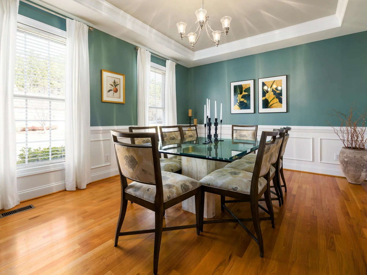 Teal wainscoted dining room with dado rail painting by Bath Decorators