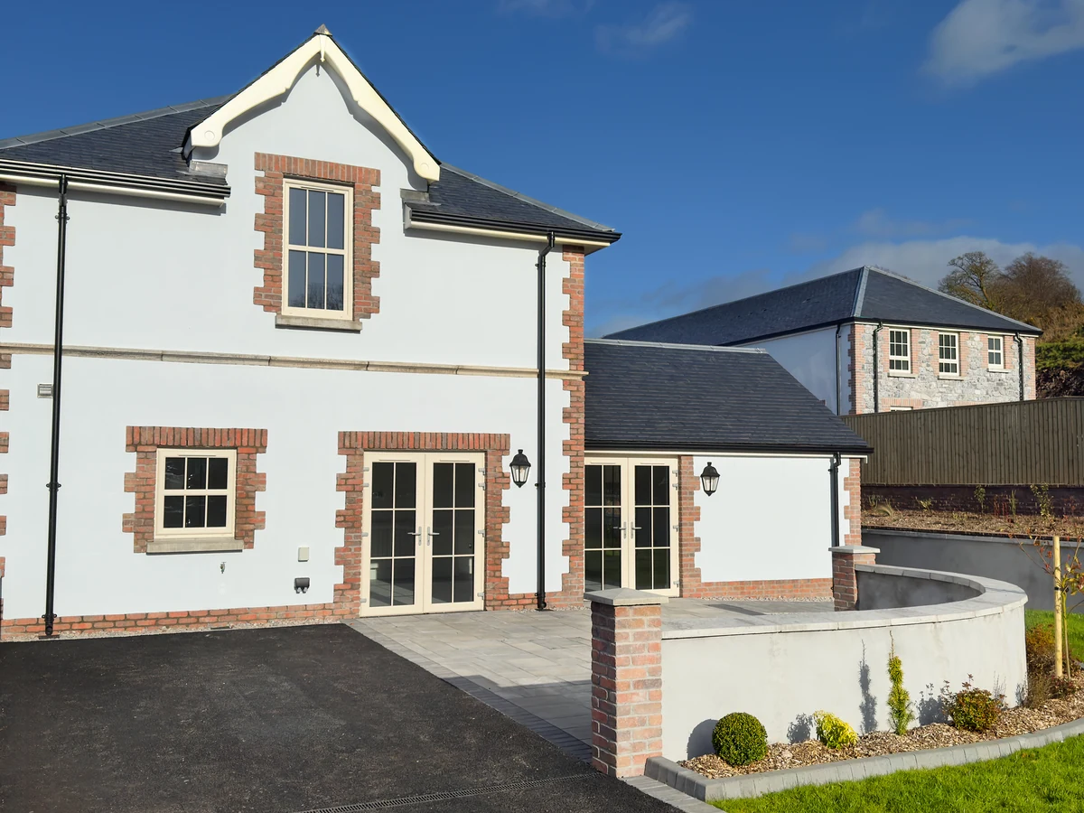 Exterior painting of white rendered property near Box by Bath Decorators
