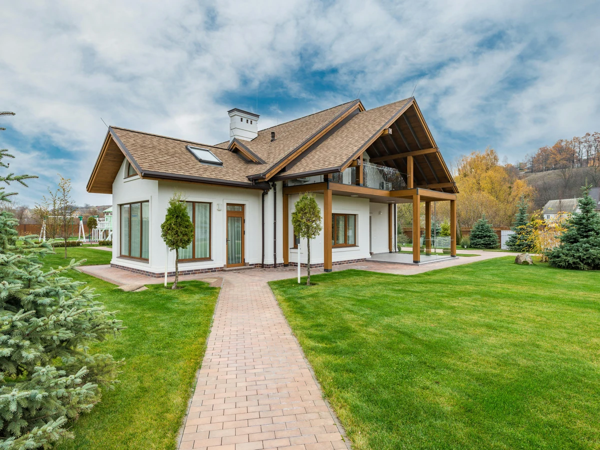 Garage door painting in Bath by Bath Decorators, white rendered house exterior