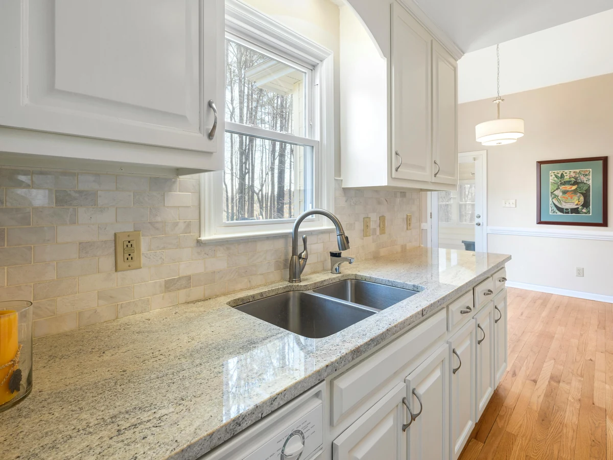 White kitchen with granite worktop, cabinet painting in Bath by Bath Decorators