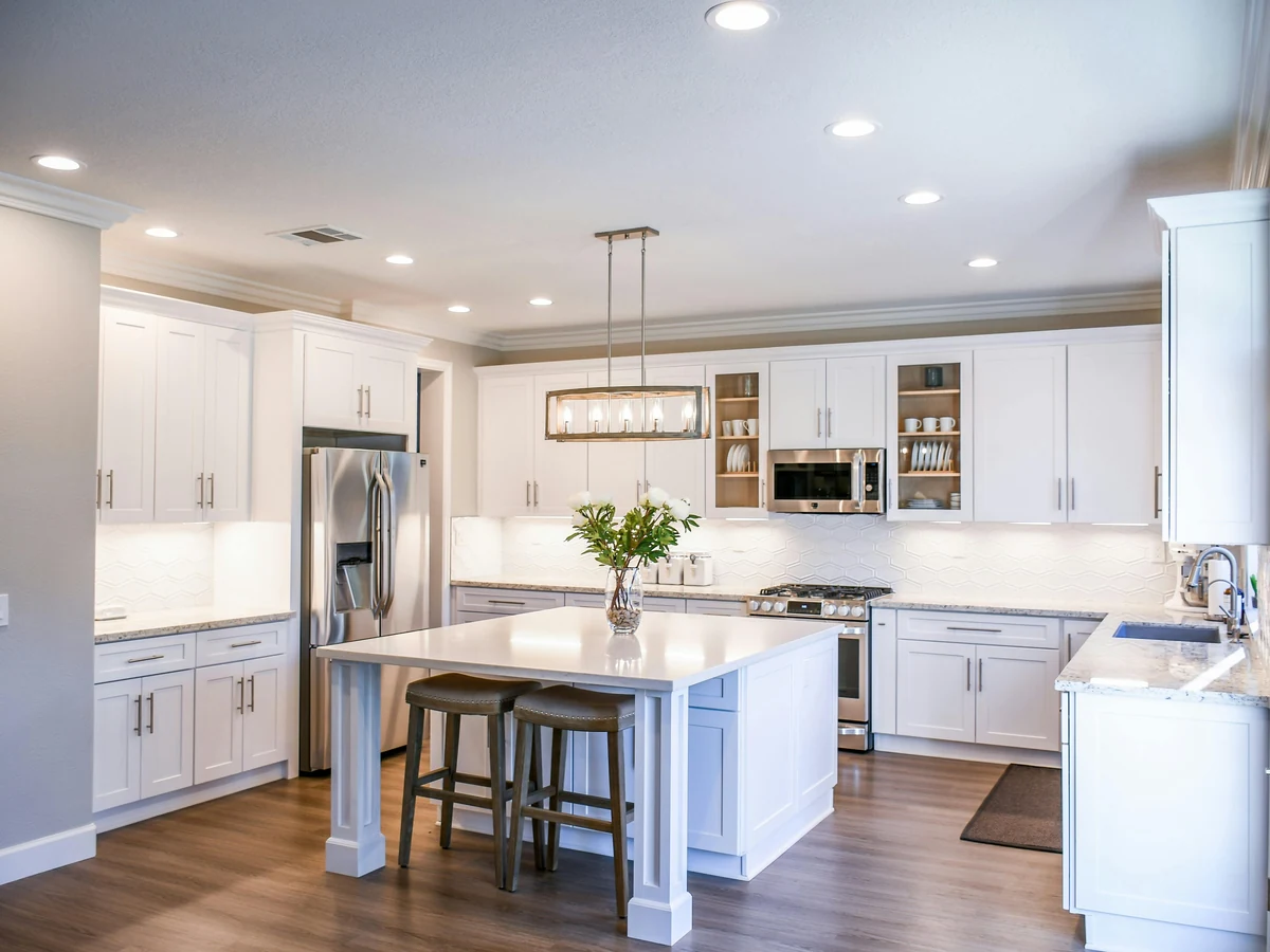 White kitchen with island unit, cabinet painting in Bath by Bath Decorators