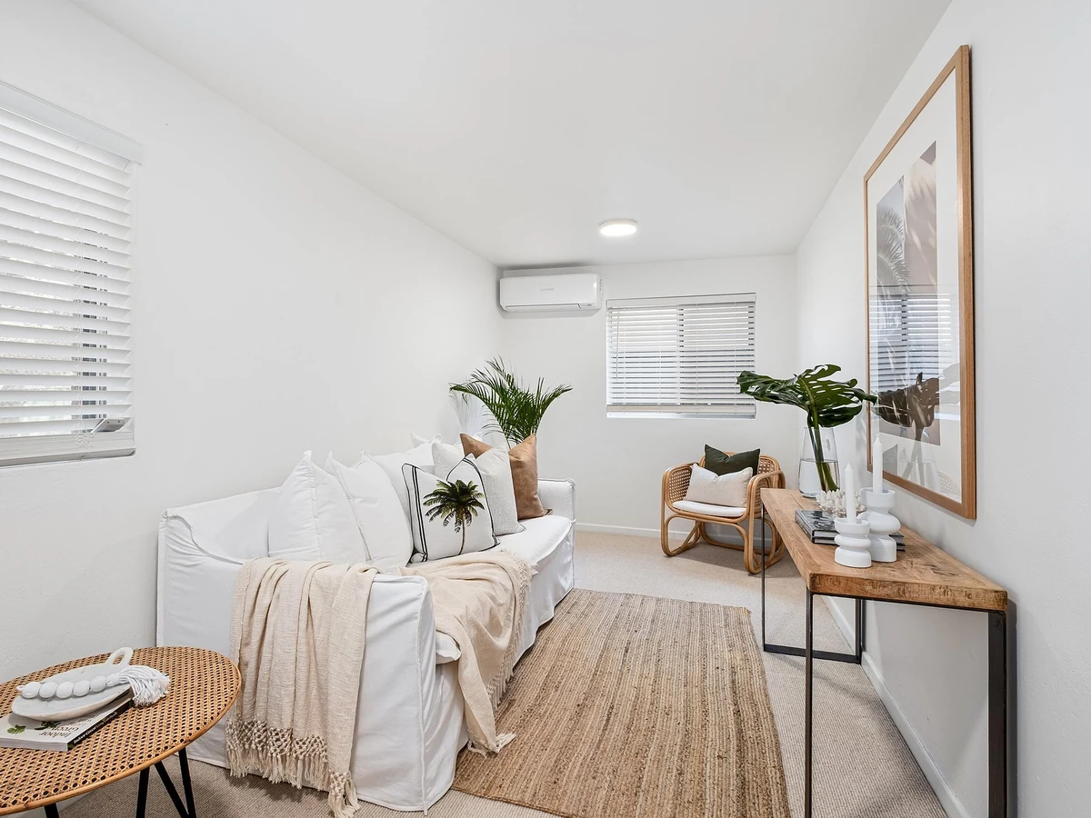 Clean minimalist living room painted by Bath Decorators